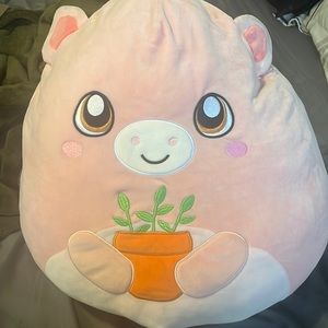 squishmallow cow with plant